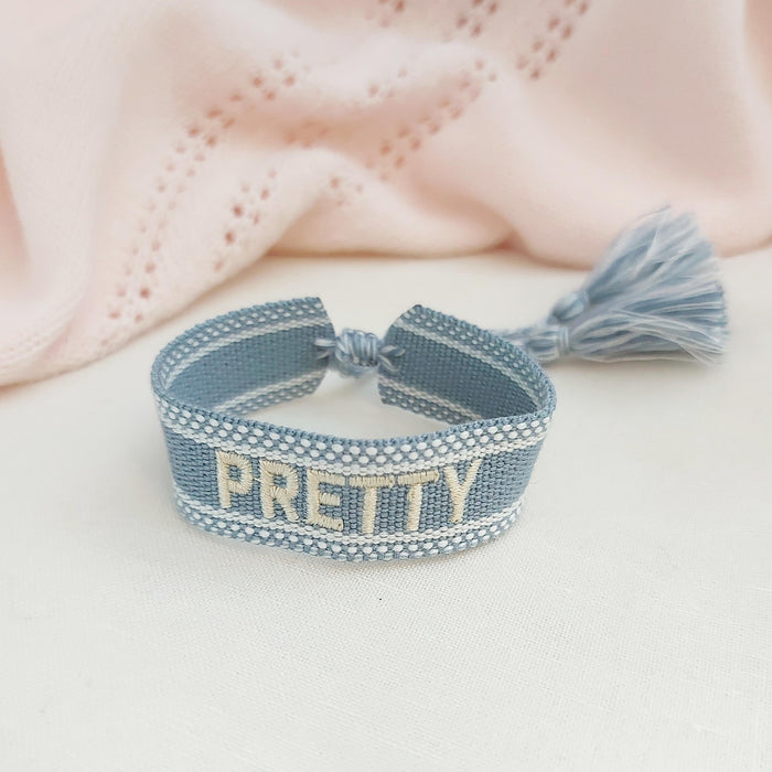 PRETTY light blue black word bracelet