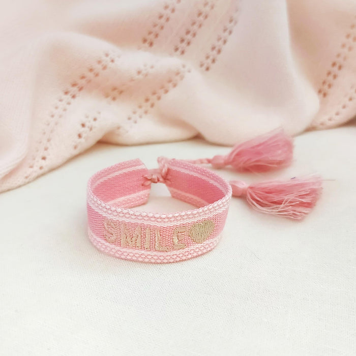 SMILE pink/beige word bracelet