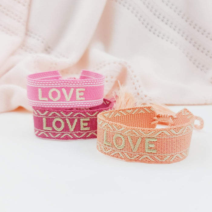 LOVE dark pink/gold word bracelet